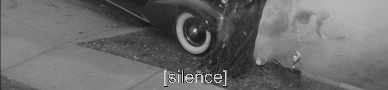 A frame from The Artist featuring the caption: [silence]