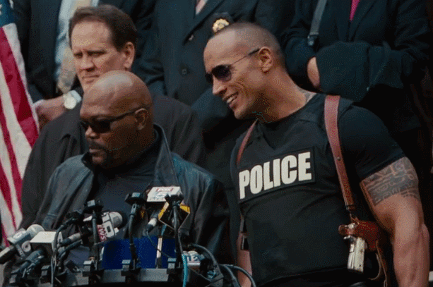 An animated reaction gif featuring Dwayne Johnon in The Other Guys saying, No comment, but yes.