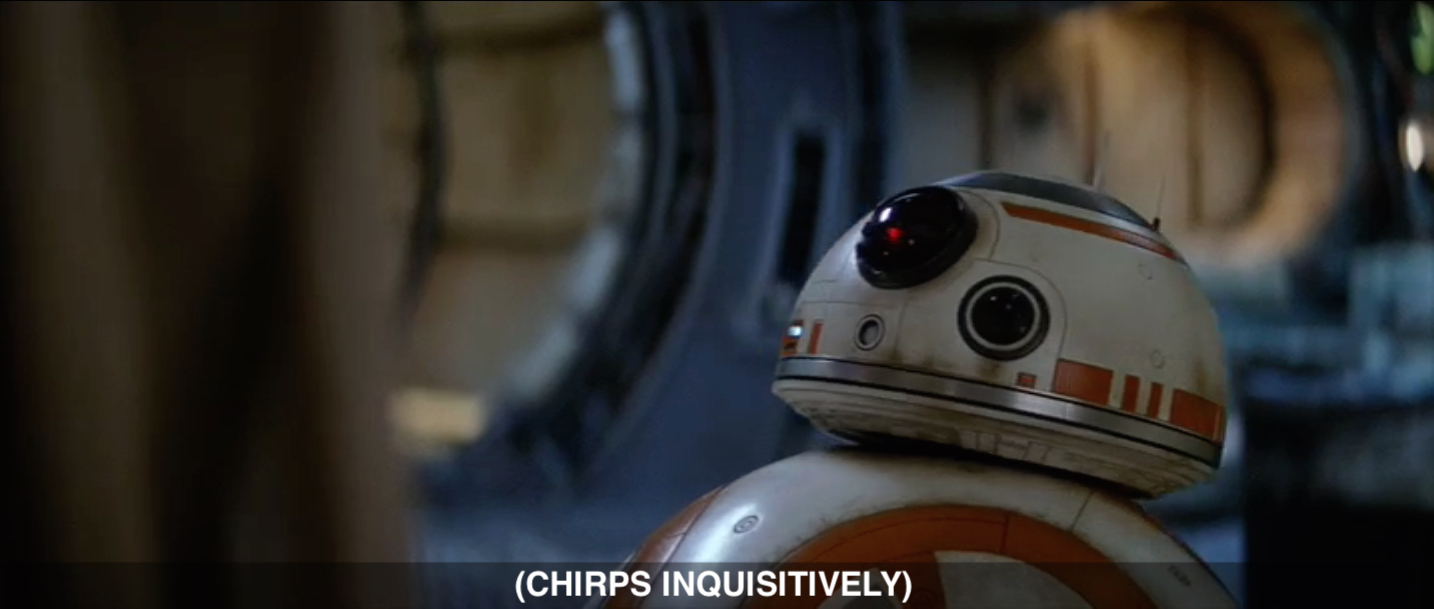 A frame from Star Wars: The Force Awakens featuring the round droid head of BB-8 and the caption: (CHIRPS INQUISITIVELY)